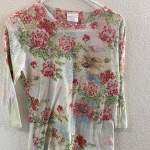 a quarter sleeve shirt with roses on it pastel colors very pretty